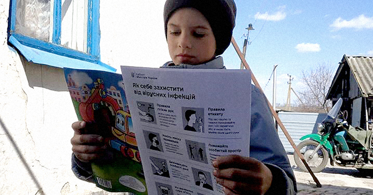 Stas reading information about the pandemic