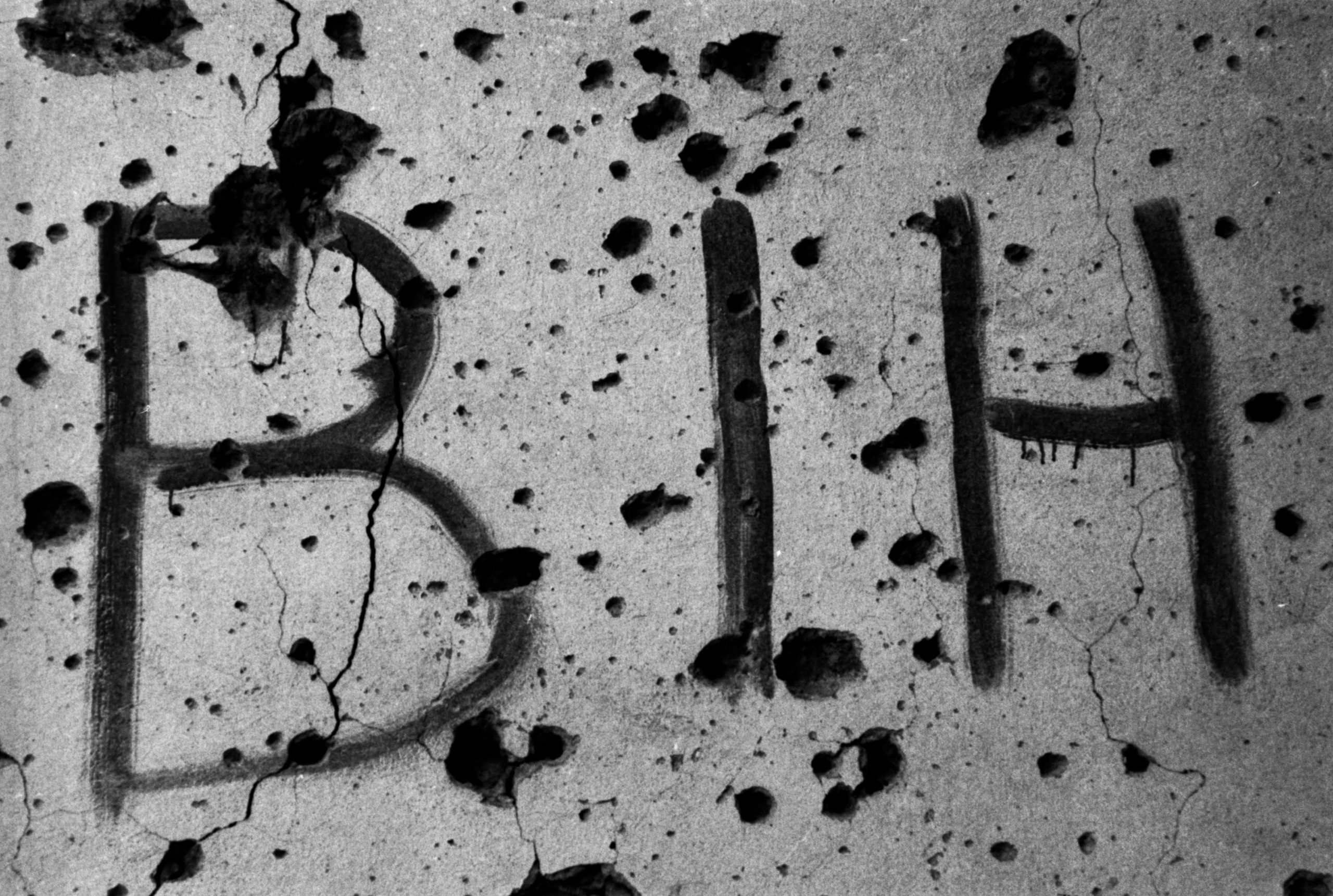 Graffiti on a bullet-riddled wall, Sarajevo