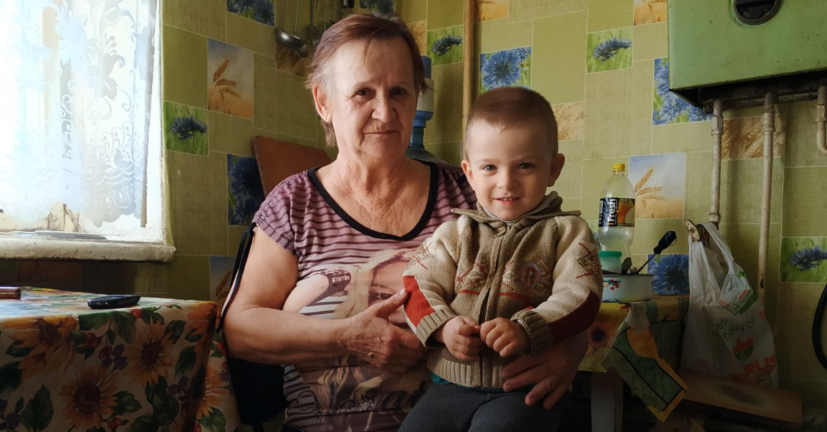 Oleksander with his grandmother, Ukraine