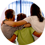 Three children with their arms around each other