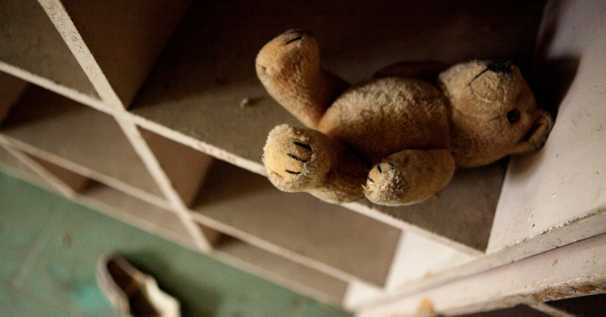 Teddy bear on an empty shelf