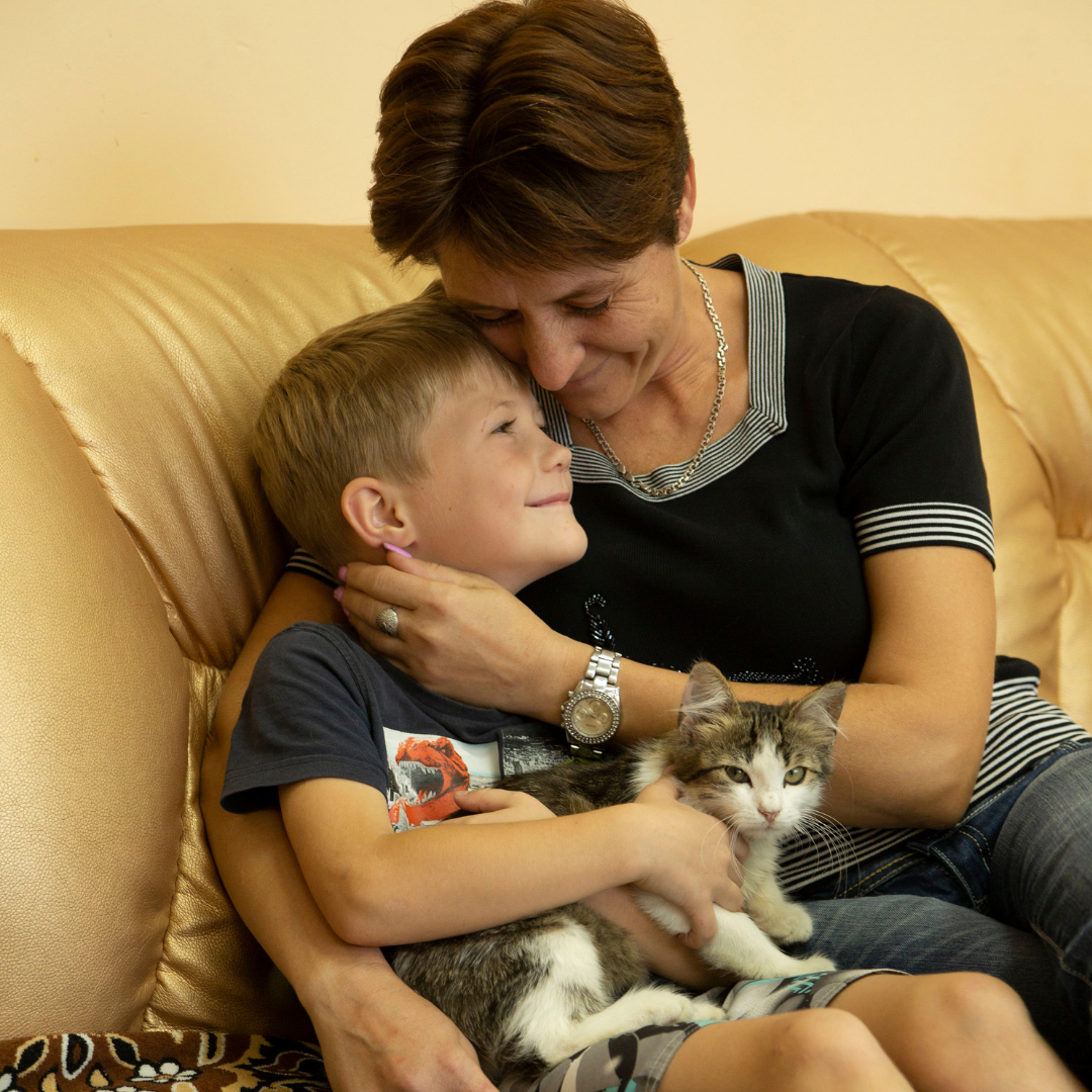 Galina and Ivan and their cat after leaving their abusive situation