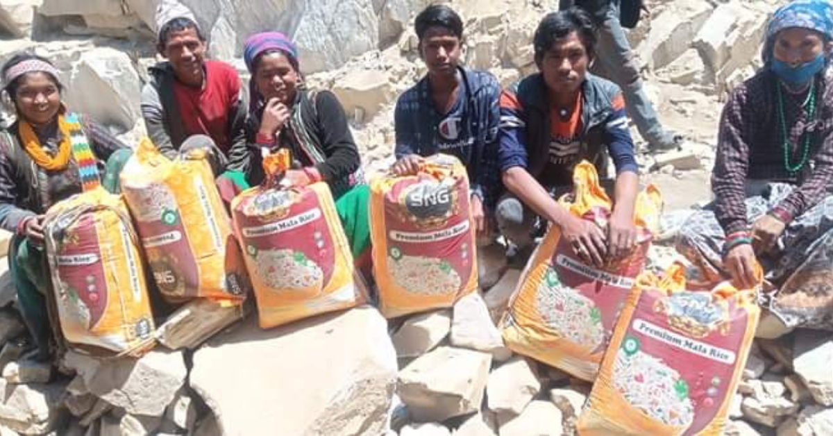 parents of reunified children with rice in a village in Humla