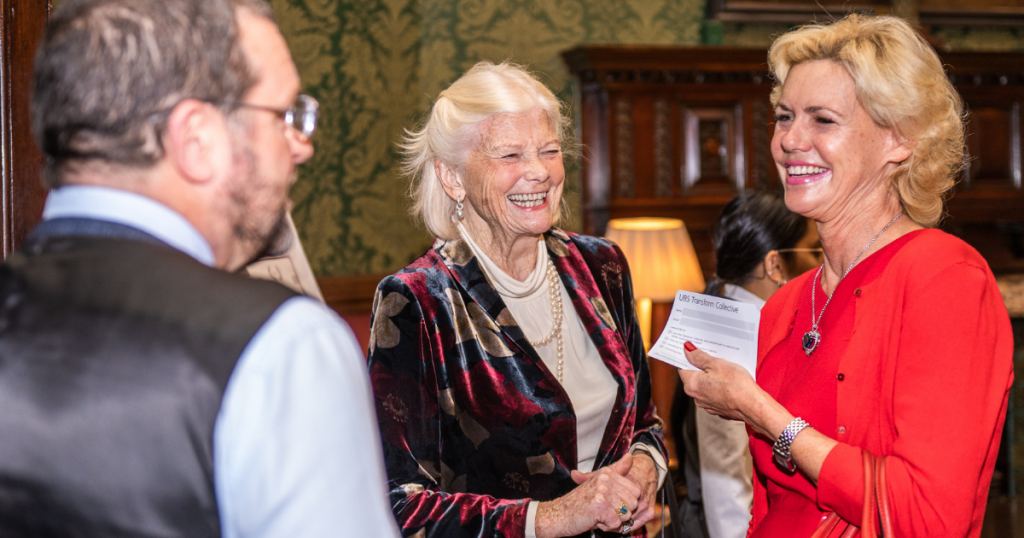 Wingston Blair Kennedy, Lady Gail Jopling and Claire Wright smiling and talking in an elegant room
